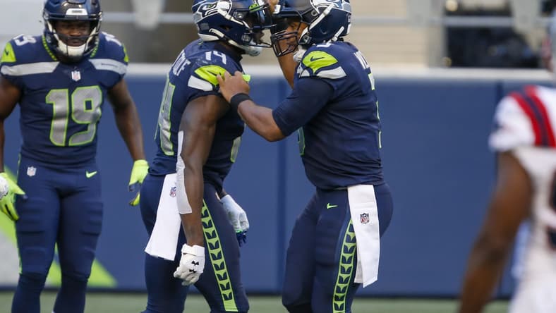 Seahawks Russell Wilson and D.K. Metcalf during NFL game against the Patriots