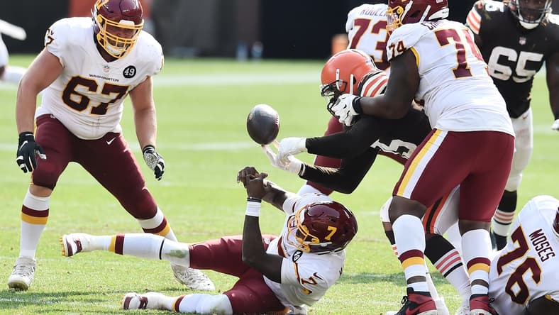 Washington QB Dwayne Haskins fumbles the ball against the Browns