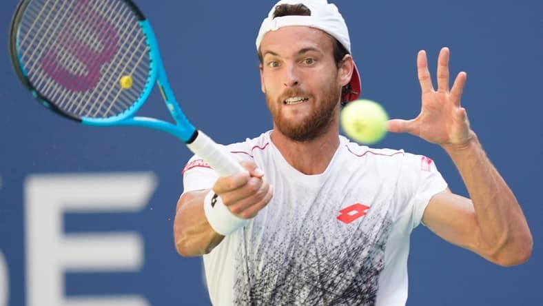 Sept 3, 2018; New York, NY, USA;  Joao Sousa of Portugal hits to Novak Djokovic of Serbia in a fourth round match on day eight of the 2018 U.S. Open tennis tournament at USTA Billie Jean King National Tennis Center. Mandatory Credit: Robert Deutsch-USA TODAY Sports