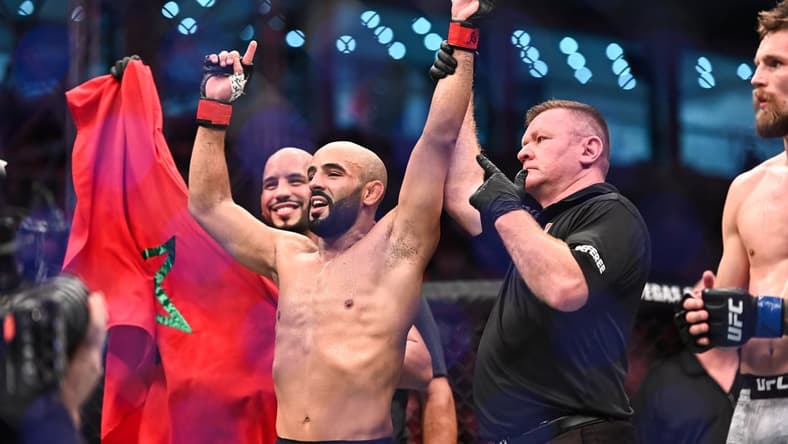 Sep 7, 2019; Abu Dhabi, UAE; Ottman Azaitar (red gloves) celebrates after defeating Teemu Packalen (blue gloves) during UFC 242 at The Arena. Mandatory Credit: Per Haljestam-USA TODAY Sports
