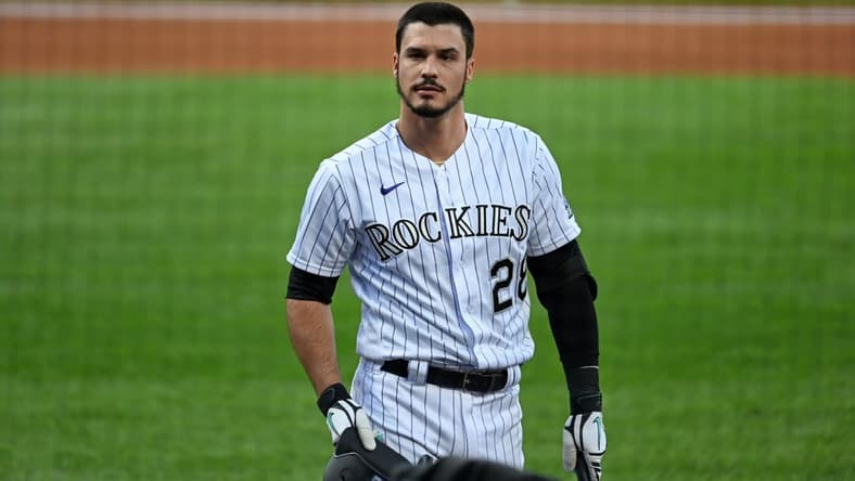 Sep 12, 2020; Denver, Colorado, USA; Colorado Rockies third baseman Nolan Arenado (28) reacts following his strikeout in the first inning against the Los Angeles Angels at Coors Field. Mandatory Credit: Ron Chenoy-USA TODAY Sports