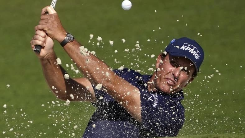 Nov 14, 2020; Augusta, Georgia, USA; Phil Mickelson plays a shot from a bunker on the second hole during the third round of The Masters golf tournament at Augusta National GC. Mandatory Credit: Michael Madrid-USA TODAY Sports