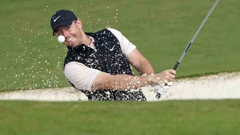 Nov 15, 2020; Augusta, Georgia, USA; Rory McIlroy plays a shot from a bunker on the second hole during the final round of The Masters golf tournament at Augusta National GC. Mandatory Credit: Michael Madrid-USA TODAY Sports