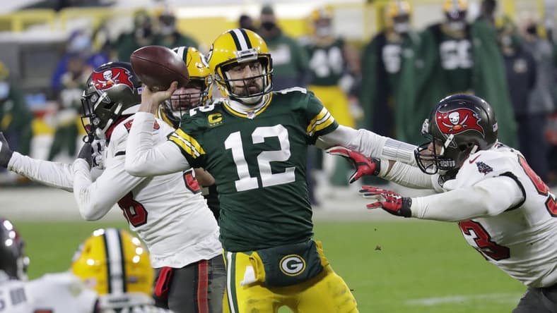 Jan 24, 2021, Green Bay, WI, USA; Green Bay Packers quarterback Aaron Rodgers (12) throws an inccomplete pass against Tampa Bay Buccaneers defensive end Ndamukong Suh (93) in the final minutes of the game during the NFC championship game Sunday, January 24, 2021, at Lambeau Field Mandatory credit: Dan Powers / Milwaukee Journal Sentinel via USA TODAY NETWORK