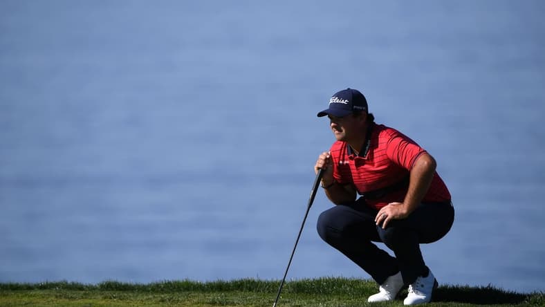 Jan 31, 2021; San Diego, California, USA; Patrick Reed lines up a putt on the second green during the final round of the Farmers Insurance Open golf tournament at Torrey Pines Municipal Golf Course - South Course. Mandatory Credit: Orlando Ramirez-USA TODAY Sports