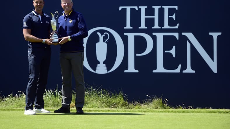Jul 17, 2017; Southport, ENG; Henrik Stenson (SWE) pose with the Claret Jug and Martin Slumbers, Chief Executive of the R&A during a practice round of The 146th Open Championship golf tournament at Royal Birkdale Golf Club. Mandatory Credit: Thomas J. Russo-USA TODAY Sports