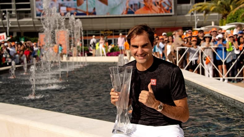 Mar 31, 2019; Miami Gardens, FL, USA; Roger Federer of Switzerland poses with the winning trophy after defeating John Isner of the United States (not pictured) during the men   s finals at the Miami Open at Miami Open Tennis Complex. Mandatory Credit: Steve Mitchell-USA TODAY Sports