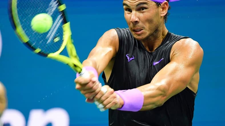Aug 27, 2019; Flushing, NY, USA; Rafael Nadal of Spain hits to John Millman of Australia in the first round on day two of the 2019 U.S. Open tennis tournament at USTA Billie Jean King National Tennis Center. Mandatory Credit: Robert Deutsch-USA TODAY Sports