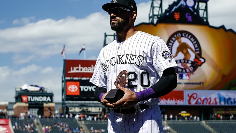 Sep 18, 2019; Denver, CO, USA; Colorado Rockies left fielder Ian Desmond (20) accepts the Roberto Clemente Award before a game against the New York Mets at Coors Field. Mandatory Credit: Isaiah J. Downing-USA TODAY Sports