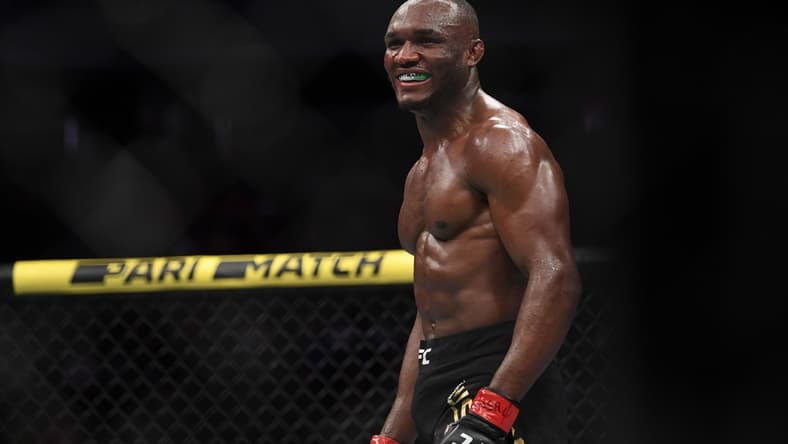 Dec 14, 2019; Las Vegas, NV, USA; Kamaru Usman (red gloves) reacts after defeating Colby Covington (not pictured) during UFC 245 at T-Mobile Arena. Mandatory Credit: Stephen R. Sylvanie-USA TODAY Sports