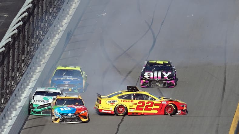 Feb 9, 2020; Daytona Beach, Florida, USA; NASCAR Cup Series driver Brad Keselowski (2) driver Kyle Busch (18) and driver Joey Logano (22) wreck into the trioval during The Clash at Dayonta at Daytona International Speedway. Mandatory Credit: John David Mercer-USA TODAY Sports