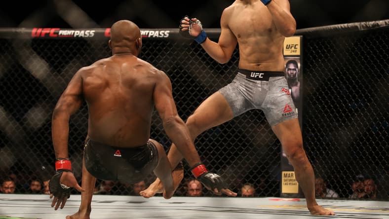 Feb 8, 2020; Houston, Texas, USA; Jone Jones (red gloves) fights Dominick Reyes (blue gloves) during a UFC championship fight at Toyota Center. Mandatory Credit: Thomas Shea-USA TODAY Sports