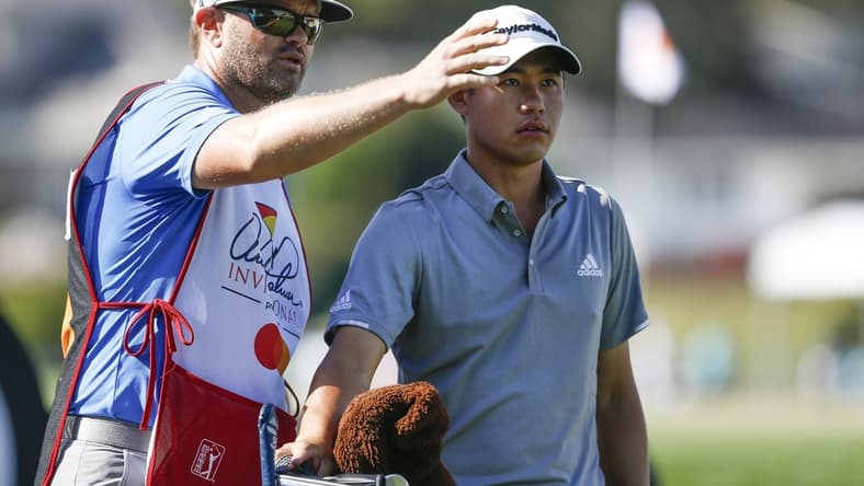 Mar 5, 2020; Orlando, Florida, USA; Colin Morikawa (right) listens to his caddie during the first round of the Arnold Palmer Invitational golf tournament at Bay Hill Club & Lodge. Mandatory Credit: Reinhold Matay-USA TODAY Sports