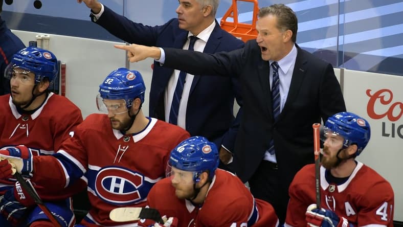 Aug 21, 2020; Toronto, Ontario, CAN; Montreal Canadiens assistant coach Dominique Ducharme (top left) and assistant coach Kirk Muller (top right) direct players during the first period in game six of the first round of the 2020 Stanley Cup Playoffs against the Philadelphia Flyers at Scotiabank Arena. Mandatory Credit: Dan Hamilton-USA TODAY Sports