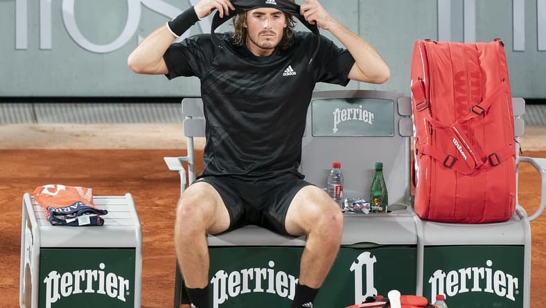 (File photo) Stefanos Tsitsipas (GRE) puts on a new headband at a change of ends during his match against Novak Djokovic (SRB) on day 13 at Stade Roland Garros. Mandatory Credit: Susan Mullane-USA TODAY Sports