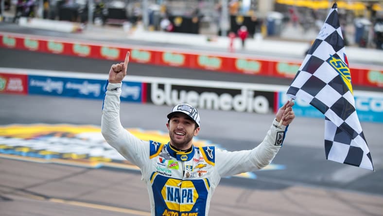 Nov 8, 2020; Avondale, Arizona, USA; NASCAR driver Chase Elliott celebrates with the checkered flag after winning the NASCAR Cup Series Championship at Phoenix Raceway. Mandatory Credit: Mark J. Rebilas-USA TODAY Sports