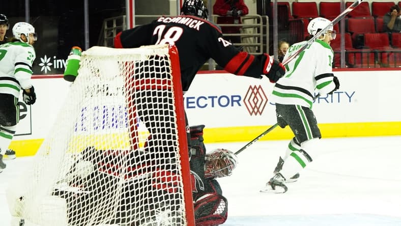 Jan 30, 2021; Raleigh, North Carolina, USA; Carolina Hurricanes goaltender Petr Mrazek (34) is hurt on a collision with Carolina Hurricanes left wing Max McCormick (28) during the first period at PNC Arena. Mandatory Credit: James Guillory-USA TODAY Sports