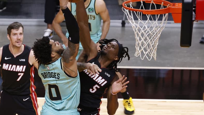 Feb 1, 2021; Miami, Florida, USA; Miami Heat forward Precious Achiuwa (5) defends Charlotte Hornets forward Miles Bridges (0) during the first half at American Airlines Arena. Mandatory Credit: Rhona Wise-USA TODAY Sports