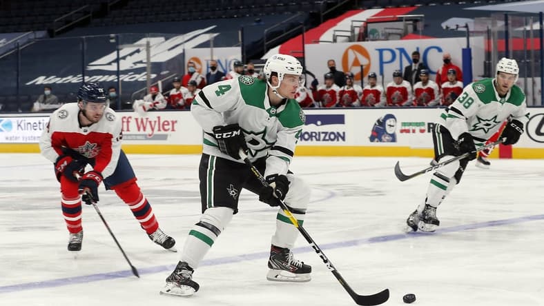 Feb 2, 2021; Columbus, Ohio, USA; Dallas Stars defenseman Miro Heiskanen (4) passes the puck against the Columbus Blue Jackets during the second period at Nationwide Arena. Mandatory Credit: Russell LaBounty-USA TODAY Sports