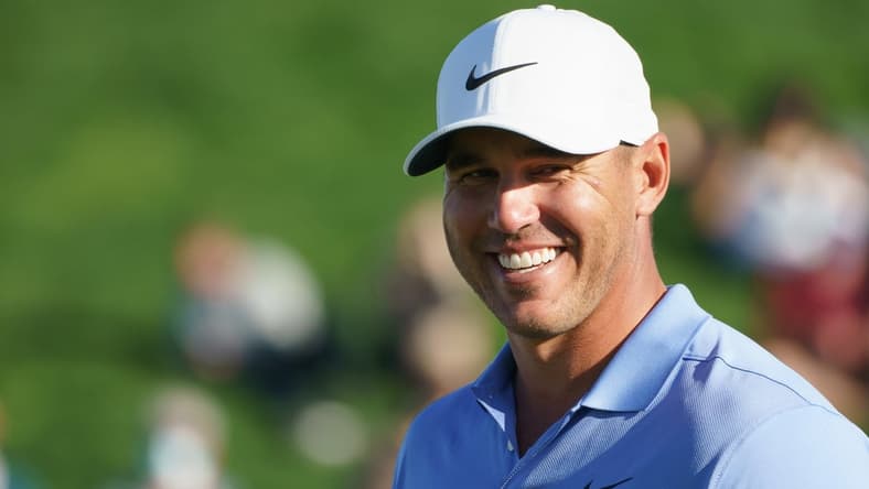 Feb 7, 2021; Scottsdale, Arizona, USA; Brooks Koepka celebrates after winning the final round of the Waste Management Phoenix Open golf tournament at TPC Scottsdale. Mandatory Credit: Allan Henry-USA TODAY Sports