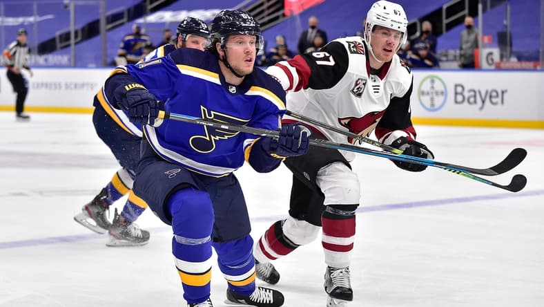 Feb 8, 2021; St. Louis, Missouri, USA; St. Louis Blues left wing Jacob De La Rose (61) skates against Arizona Coyotes left wing Lawson Crouse (67) during the first period at Enterprise Center. Mandatory Credit: Jeff Curry-USA TODAY Sports