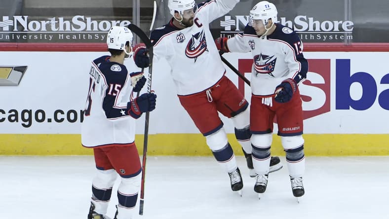 Feb 11, 2021; Chicago, Illinois, USA; Columbus Blue Jackets right wing Cam Atkinson (13) celebrates his goal against the Chicago Blackhawks with Jackets left wing Nick Foligno (71) during the first period at United Center. Mandatory Credit: David Banks-USA TODAY Sports