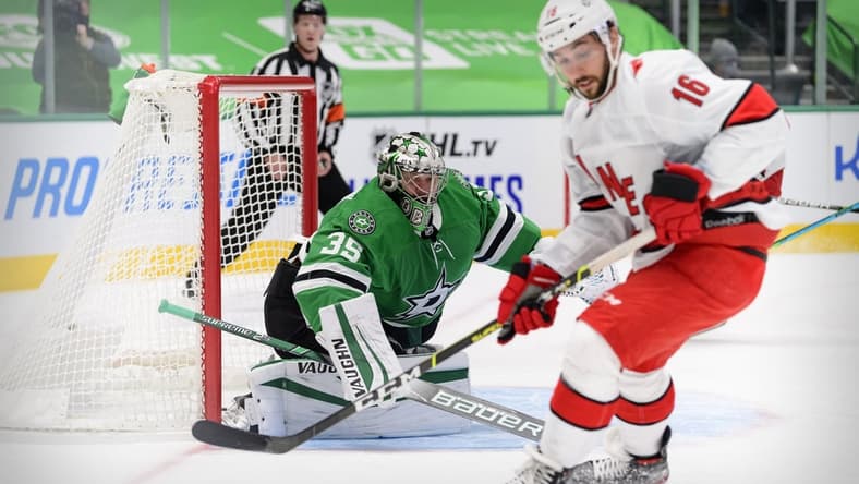 Feb 11, 2021; Dallas, Texas, USA; Dallas Stars goaltender Anton Khudobin (35) defends the goal against Carolina Hurricanes center Vincent Trocheck (16) during the first period at the American Airlines Center. Mandatory Credit: Jerome Miron-USA TODAY Sports