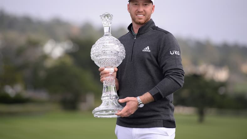 Feb 14, 2021; Pebble Beach, California, USA; Daniel Berger poses with the winner's trophy after the final round of the AT&T Pebble Beach Pro-Am golf tournament at Pebble Beach Golf Links. Mandatory Credit: Orlando Ramirez-USA TODAY Sports