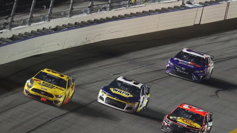 Feb 14, 2021; Daytona Beach, Florida, USA; NASCAR Cup Series driver Michael McDowell (34) leads NASCAR Cup Series driver Chase Elliott (9) and Austin Dillon (3) to win the during the Daytona 500 at Daytona International Speedway. Mandatory Credit: Mark J. Rebilas-USA TODAY Sports