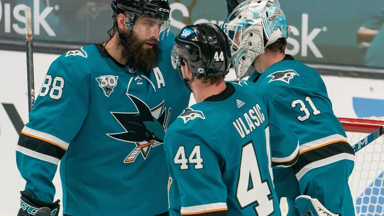 Feb 15, 2021; San Jose, California, USA; San Jose Sharks defenseman Brent Burns (88) celebrates with goaltender Martin Jones (31) and defenseman Marc-Edouard Vlasic (44) after defeating the Anaheim Ducks at SAP Center at San Jose. Mandatory Credit: Stan Szeto-USA TODAY Sports