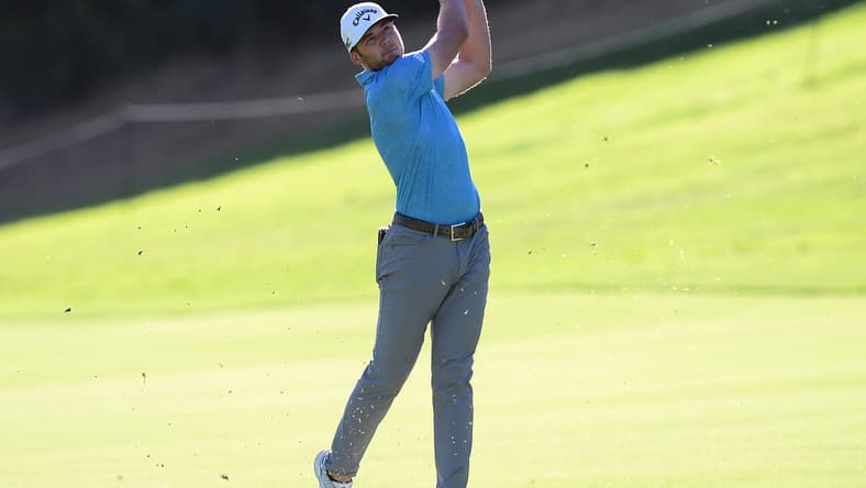 Feb 18, 2021; Pacific Palisades, California, USA; Sam Burns plays his shot on the eighteenth hole fairway during the first round of The Genesis Invitational golf tournament at Riviera Country Club. Mandatory Credit: Gary A. Vasquez-USA TODAY Sports