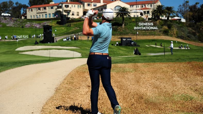 Feb 19, 2021; Pacific Palisades, California, USA; Sam Burns plays his shot on the rough of the ninth hole course during the second round of The Genesis Invitational golf tournament at Riviera Country Club. Mandatory Credit: Gary A. Vasquez-USA TODAY Sports