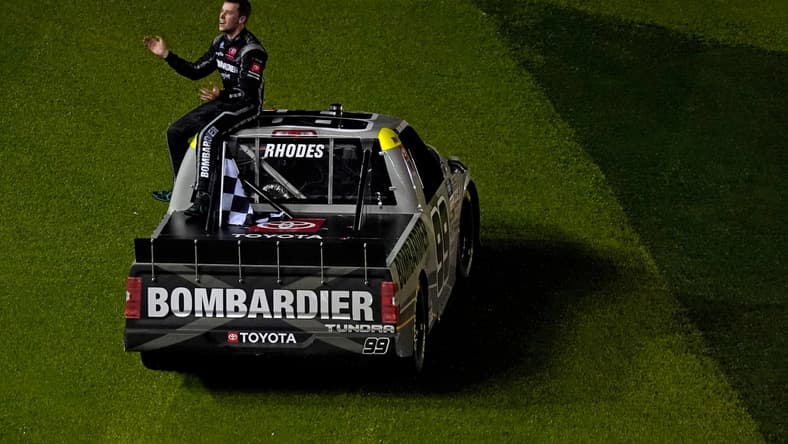 Feb 19, 2021; Daytona Beach, FL, USA; NASCAR Truck Series driver Ben Rhodes (99) sits on his truck after celebrating his win in the Brake Best Select 159 at the Daytona International Speedway Road Course. Mandatory Credit: Jasen Vinlove-USA TODAY Sports