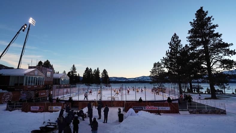 Feb 21, 2021; Stateline, Nevada, USA; A general view as the sun sets during the first period in a NHL Outdoors hockey game between the Philadelphia Flyers and the Boston Bruins at Lake Tahoe. Mandatory Credit: Kirby Lee-USA TODAY Sports