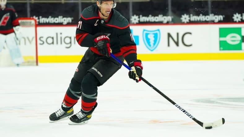 Feb 17, 2021; Raleigh, North Carolina, USA; Carolina Hurricanes center Jordan Staal (11) skates with the puck against the Florida Panthers at PNC Arena. Mandatory Credit: James Guillory-USA TODAY Sports