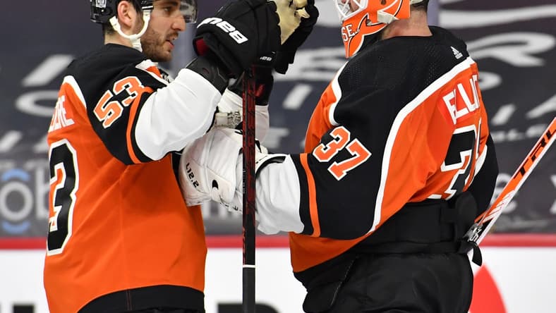Feb 24, 2021; Philadelphia, Pennsylvania, USA; Philadelphia Flyers defenseman Shayne Gostisbehere (53) and Philadelphia Flyers goaltender Brian Elliott (37) celebrate the win against the New York Rangers at Wells Fargo Center. Mandatory Credit: Eric Hartline-USA TODAY Sports