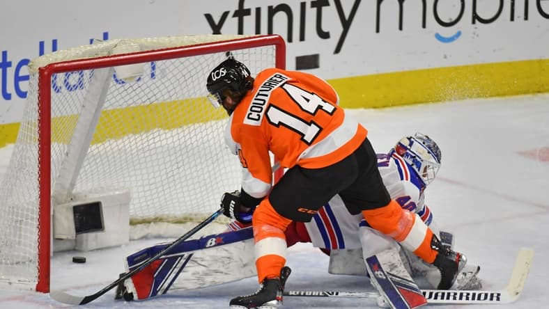 Feb 18, 2021; Philadelphia, Pennsylvania, USA; Philadelphia Flyers center Sean Couturier (14) scores a goal against New York Rangers goaltender Alexandar Georgiev (40) during the shootout period at Wells Fargo Center. Mandatory Credit: Eric Hartline-USA TODAY Sports