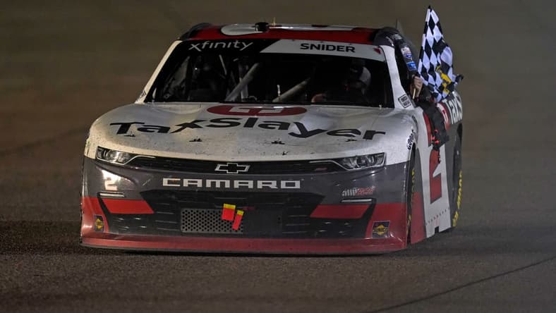 Feb 27, 2021; Miami, FL, USA; NASCAR Xfinity Series driver Myatt Snider (2) does a victory lap after winning the Contender Boats 250 at Homestead-Miami Speedway. Mandatory Credit: Jasen Vinlove-USA TODAY Sports