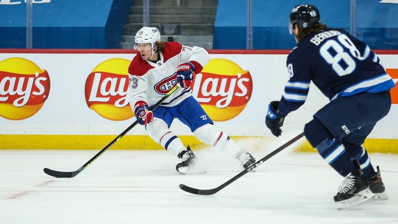 Feb 27, 2021; Winnipeg, Manitoba, CAN;   Montreal Canadiens forward Tyler Toffoli (73) turns away from Winnipeg Jets defenseman Nathan Beaulieu (88) during the first period at Bell MTS Place. Mandatory Credit: Terrence Lee-USA TODAY Sports