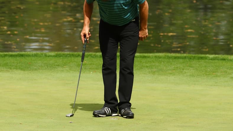 Apr 4, 2018; Augusta, GA, USA; Nick Faldo takes a bow on the 9th green during the Par 3 Contest before the Masters golf tournament at Augusta National Golf Club. Mandatory Credit: Rob Schumacher-USA TODAY Sports