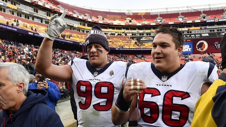 Nov 18, 2018; Landover, MD, USA; Houston Texans defensive end J.J. Watt (99) and center Nick Martin (66) celebrate after defeating the Washington Redskins at FedEx Field. Mandatory Credit: Brad Mills-USA TODAY Sports