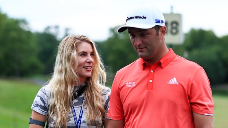 Jul 19, 2020; Dublin, Ohio, USA; Kelley Cahill (left) talks with husband Jon Rahm (right) after he wins The Memorial Tournament at Muirfield Village Golf Club. Mandatory Credit: Aaron Doster-USA TODAY Sports