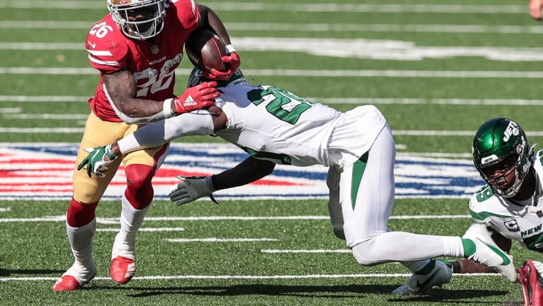 Sep 20, 2020; East Rutherford, New Jersey, USA; San Francisco 49ers running back Tevin Coleman (26) carries the ball as New York Jets free safety Marcus Maye (20) tackles during the second half at MetLife Stadium. Mandatory Credit: Vincent Carchietta-USA TODAY Sports