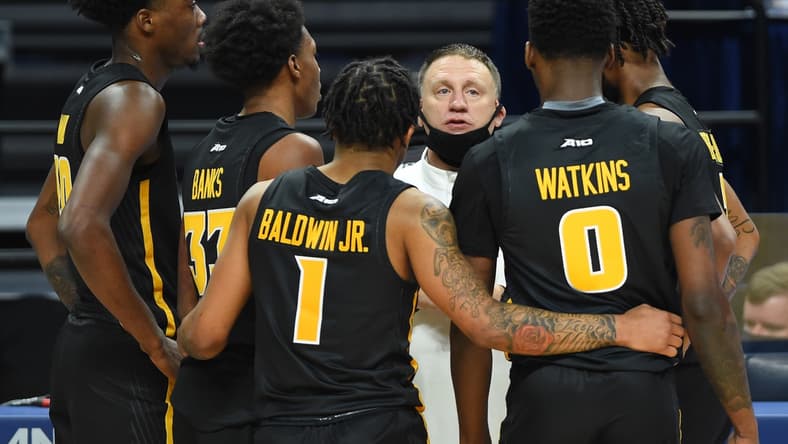 Dec 2, 2020; University Park, Pennsylvania, USA; Virginia Commonwealth Rams head coach Mike Rhoades talks with his team during a time-out in the second half against the Penn State Nittany Lions at the Bryce Jordan Center. Mandatory Credit: Rich Barnes-USA TODAY Sports