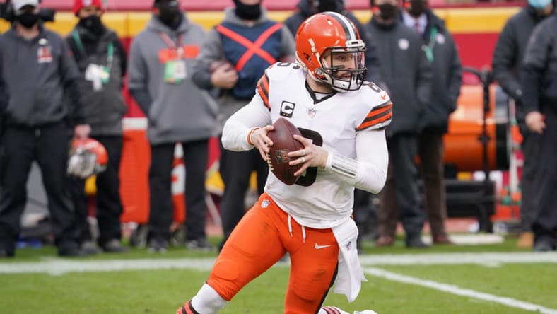 Jan 17, 2021; Kansas City, Missouri, USA; Cleveland Browns quarterback Baker Mayfield (6) drops back to pass during the AFC Divisional Round playoff game against the Kansas City Chiefs at Arrowhead Stadium. Mandatory Credit: Denny Medley-USA TODAY Sports