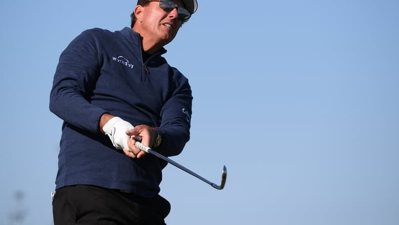 Jan 28, 2021; San Diego, California, USA; Phil Mickelson plays his shot from the 12th tee during the first round of the Farmers Insurance Open golf tournament at Torrey Pines Municipal Golf Course. Mandatory Credit: Orlando Ramirez-USA TODAY Sports
