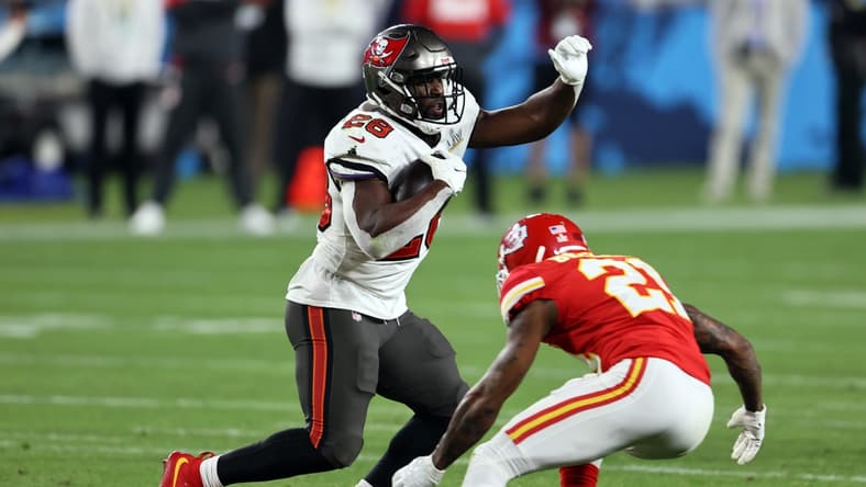 Feb 7, 2021; Tampa, FL, USA; Tampa Bay Buccaneers running back Leonard Fournette (28) runs the ball against Kansas City Chiefs cornerback Bashaud Breeland (21) during the fourth quarter in Super Bowl LV at Raymond James Stadium. Mandatory Credit: Matthew Emmons-USA TODAY Sports