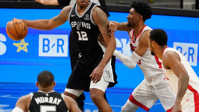 Jan 14, 2021; San Antonio, Texas, USA; San Antonio Spurs forward LaMarcus Aldridge (12) post up against Houston Rockets center Christian Wood (35) in the third quarter at AT&T Center. Mandatory Credit: Scott Wachter-USA TODAY Sports