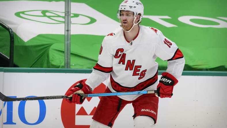 Feb 11, 2021; Dallas, Texas, USA; Carolina Hurricanes defenseman Dougie Hamilton (19) in action during the game between the Dallas Stars and the Carolina Hurricanes at the American Airlines Center. Mandatory Credit: Jerome Miron-USA TODAY Sports