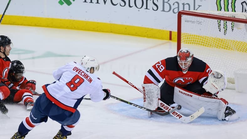 Feb 28, 2021; Newark, New Jersey, USA; New Jersey Devils goaltender Mackenzie Blackwood (29) blocks a shot by Washington Capitals left wing Alex Ovechkin (8) during the first period at Prudential Center. Mandatory Credit: Vincent Carchietta-USA TODAY Sports